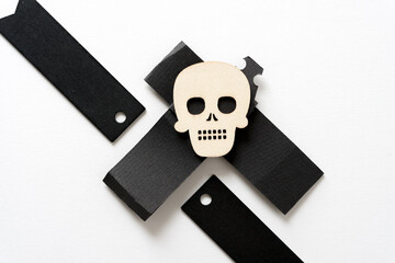 retro halloween wooden shape (skull) on black paper and wood tags