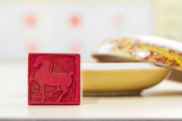 Chinese craftsman carving a stone seal