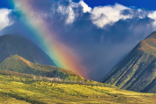 Colors of a rainbow slashing across the west maui mountains.