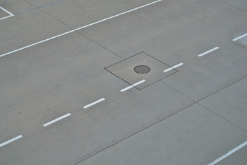 Road markings on a concrete airfield as a background