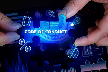 Business, Technology, Internet and network concept. Young businessman working on a virtual screen of the future and sees the inscription: Code of conduct