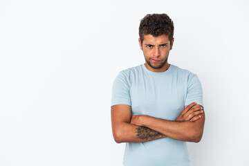 Young handsome Brazilian man isolated on white background feeling upset