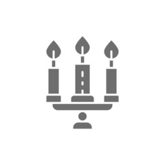 Candlestick, chandelier with candles grey icon. Isolated on white background
