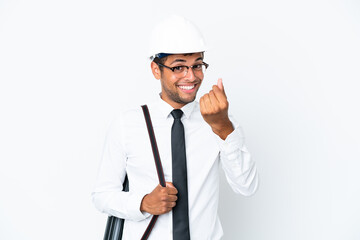 Architect brazilian man with helmet and holding blueprints making money gesture
