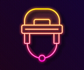 Glowing neon line Hockey helmet icon isolated on black background. Vector