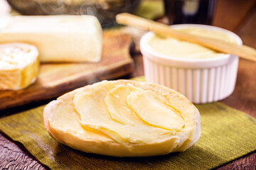 slices of French bread, Brazilian bread served hot, with lots of butter. Called bald bread, baguette or brazilian baguette