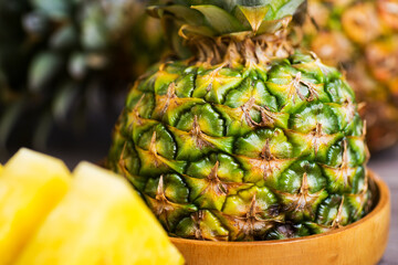 half fresh pineapple and slices close-up