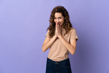 Young caucasian woman isolated on purple background keeps palm together. Person asks for something