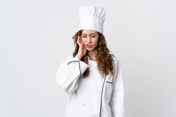 Young chef woman isolated on white background with headache