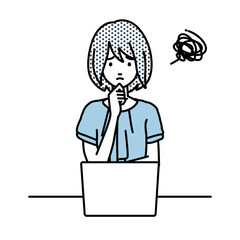 デスクで座ってPCを開いて困っているオフィスカジュアルの女性