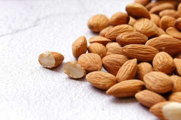 Whole almond nuts with white background.