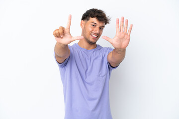 Fototapeta premium Young caucasian handsome man isolated on white background counting seven with fingers