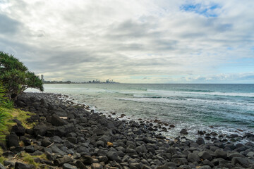 Fototapeta na wymiar Stony beach at Burleigh Heads, on an overcast day.