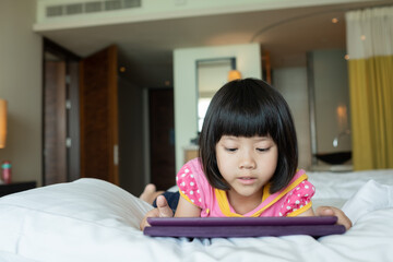 Fototapeta premium kid watching tablet, child addicted cartoon