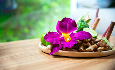 Spa Thai setting for aroma therapy and sugar and salt massage with flower on the bed, relax and healthy care. Healthy Concept