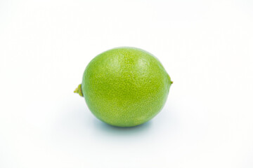 green lemons on white background
