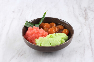 Es Bubur Sumsum or Es Bubur Lemu Bandung, Popular Traditional Porridge from West Java, Made from Rice Flour, Candil (Sticky Rice Ball), and Tapioca Pearl. Served with Palm Sugar Syrup and Coconut Milk