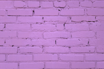 The texture of the wall made of purple bricks. Construction masonry.