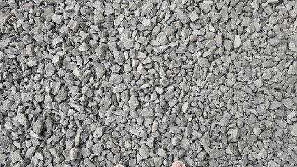 The texture of gray stones. Road surface. Minerals.