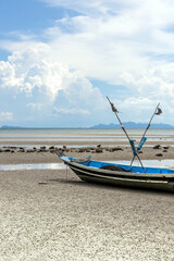 Naklejka premium fishing boat on the beach