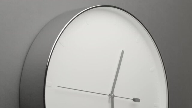 From 12 to 1 Clock Face on Grey Wall