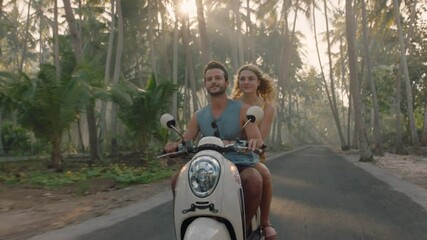 travel couple riding motorcycle on tropical island exploring beautiful travel destination having fun ride on scooter
