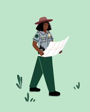 Female forest ranger on duty in a national park. Park ranger walking on a trail patrolling nature reserve with map and radio. 