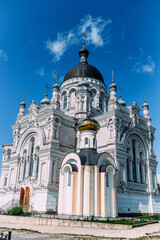 Fototapeta na wymiar Kazan women's monastery. Different angles. Domes. Towers. Arch of the main entrance. Kazan Cathedral.