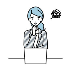 デスクで座ってPCを開いて困っているスーツの女性