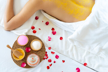 Beautiful woman having exfoliation treatment in spa.