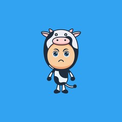 Cute cartoon angry boy wearing cow costume