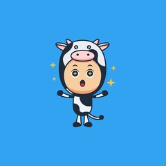 funny cute boy wearing cow costume with a smile