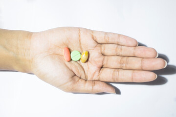 Top view of pills and medicine in hands and white background, Hands holding pills and medicine
