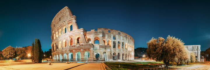 Rome, Italy. Colosseum Also Known As Flavian Amphitheatre In Evening Or Night Time. - obrazy, fototapety, plakaty