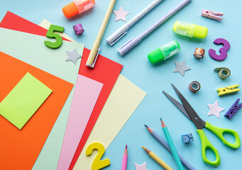 Frame of different stationery on blue background