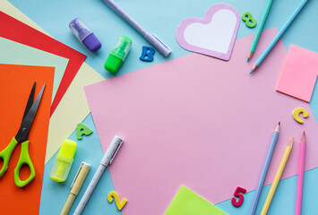 Frame of different stationery on blue background
