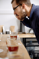 Barista examining freshly brewed coffee