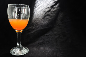 glass and orange drink