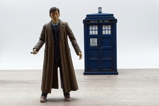 Bologna - Italy - September 2, 2021: Action figure of Doctor Who in front of a Police call box. Tardis from Doctor Who