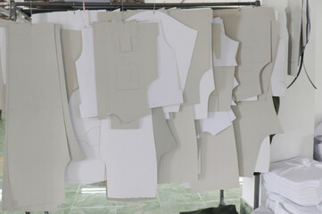 Tailor Pattern suit holding at the wall