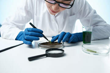 cheerful female biologist in a white coat scientist laboratory