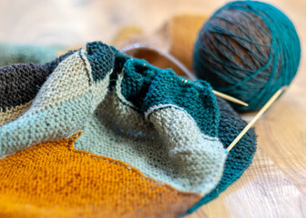 colored knitting, needles and a ball of wool yarn, knitting as a hobby, handmade