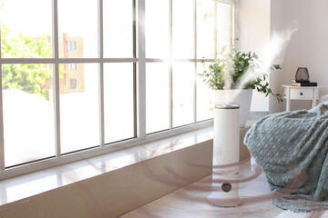 Modern humidifier near window in bedroom - obrazy, fototapety, plakaty