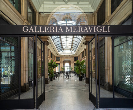 Gallery with bright glass and wrought iron roof and floor with floral decorations, Galleria Meravigli 1928, Milan, Italy.