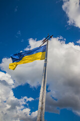Flag of Ukraine on blue sky background. Flag of ukraine on a flagpole