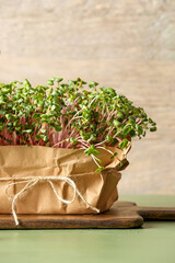 Fresh micro green on wooden background, closeup