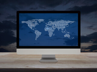 2022 start up business icon with global words world map on desktop modern computer monitor screen on wooden table over sunset sky, Happy new year 2022 global business start up concept, Elements of thi