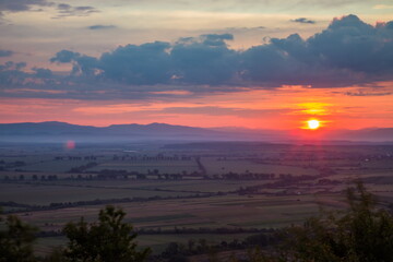 Dawn in the mountains. The sun rises from behind the mountains.