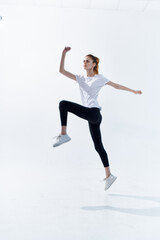 athletic woman in white t-shirt caps energy workout fun