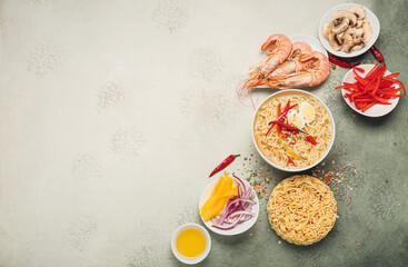 Composition with tasty Thai soup and ingredients on light background